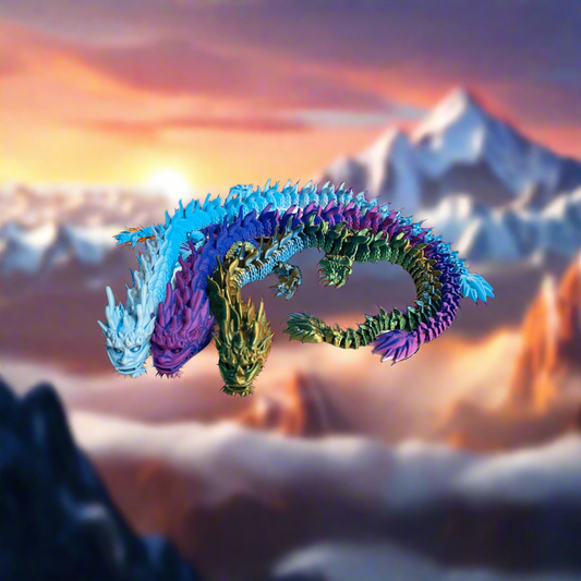 A colorful 3D printed dragon figurine with articulated joints, featuring a mix of blue, green, and yellow scales.