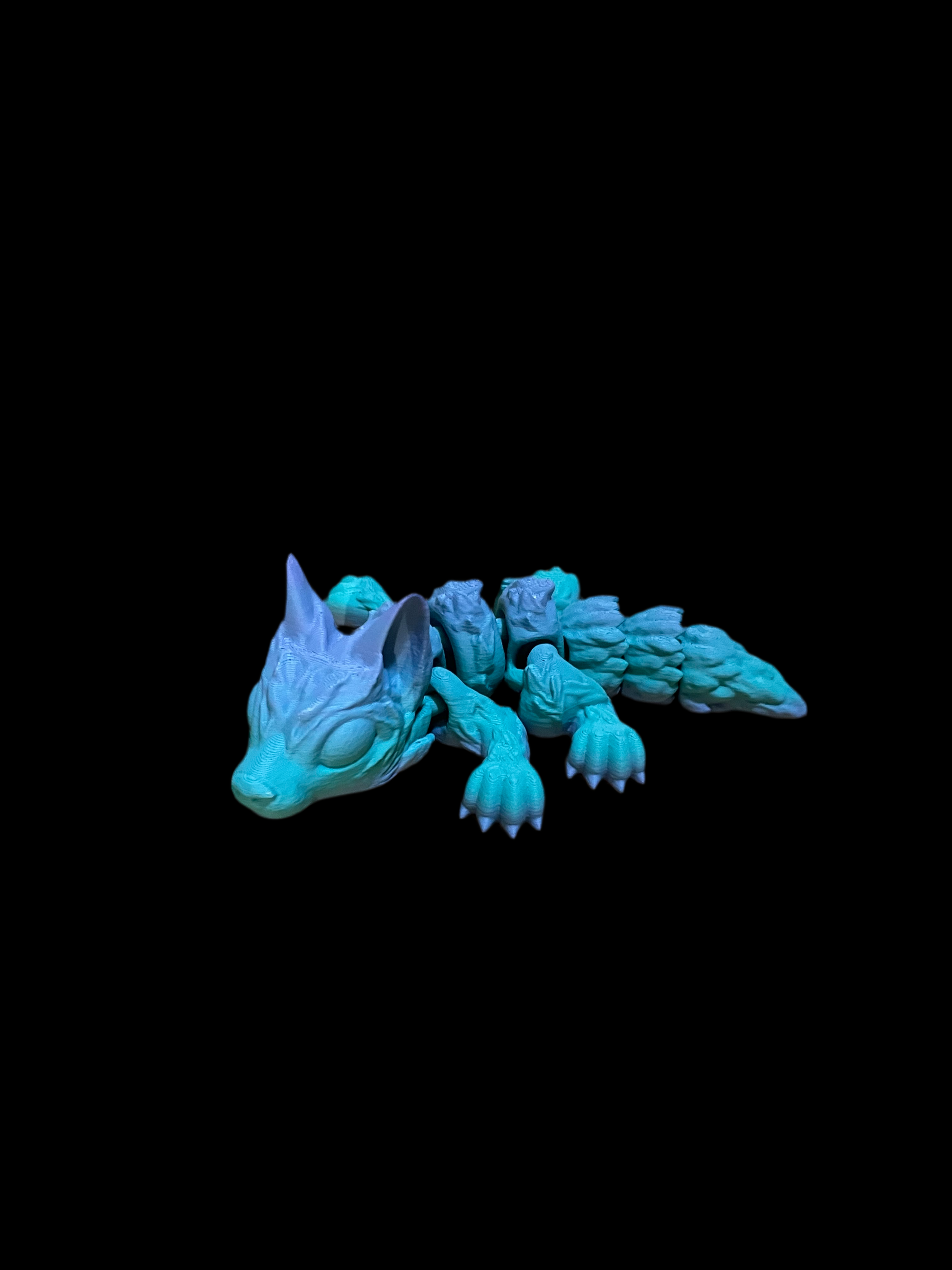 Tiny wolf pup 3D print in gradient blue and purple design.