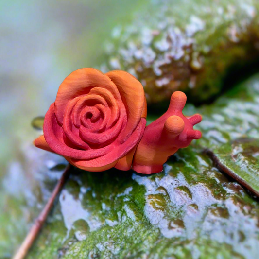 3D printed snail with a rose-shaped shell in vibrant orange and pink.