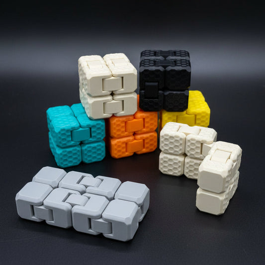 Colorful cube-shaped fidget toys on a dark background